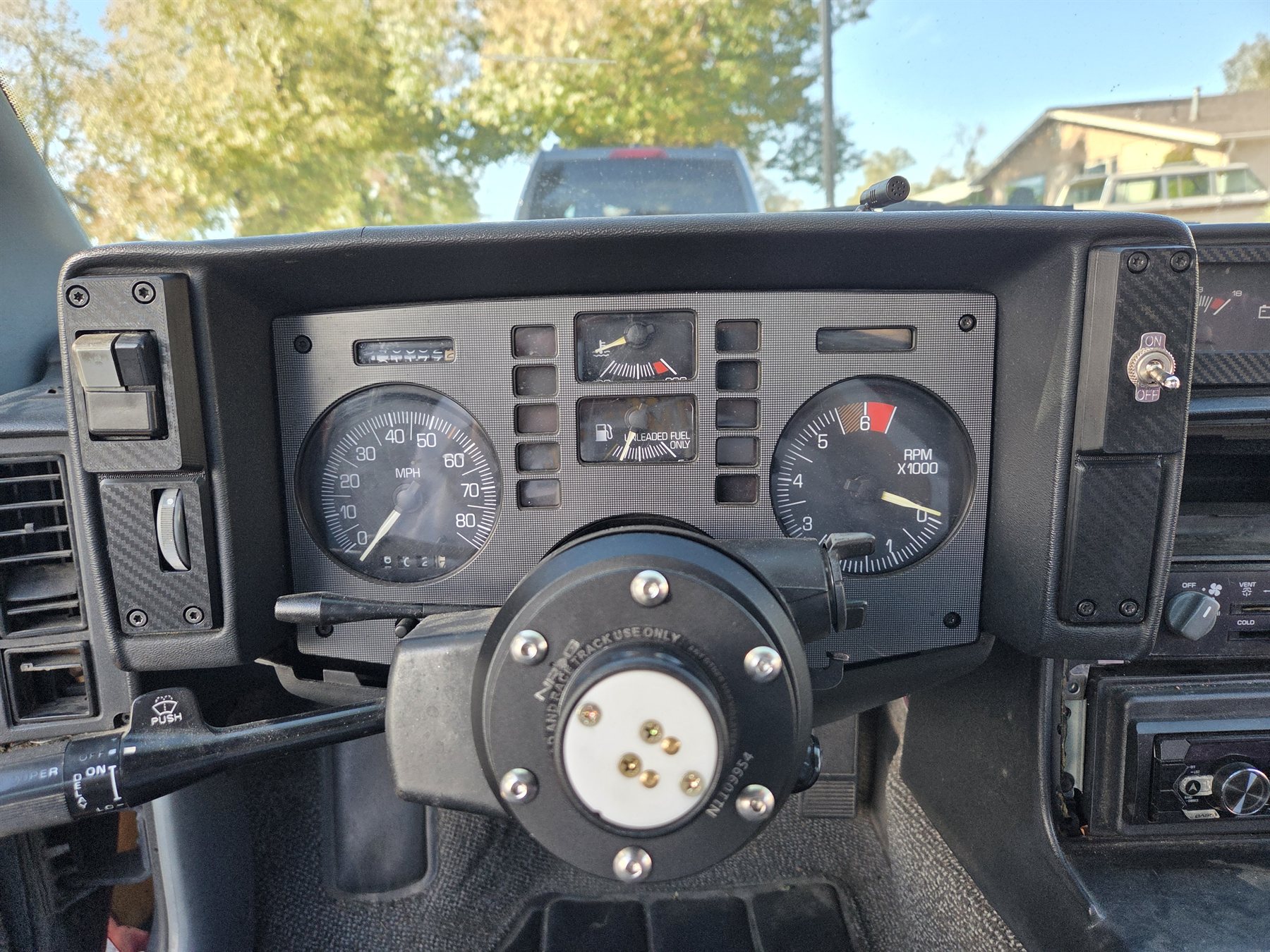 Pontiac Fiero gauge cluster with reproduction side panels on both sides