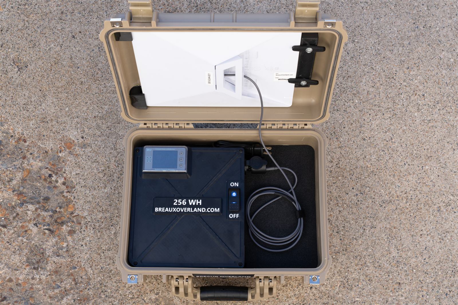 Rental case from above: Starlink Mini in the lid, 256 Wh battery box with charge meter and power switch, and the dish cable